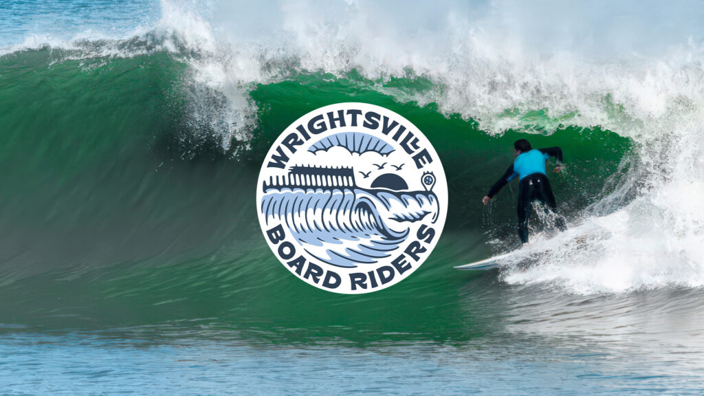 Surfer riding a powerful green wave with Wrightsville Board Riders USA logo, representing American boardriders surf club and surfing competitions.