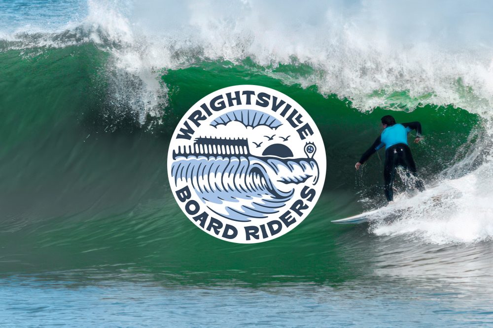 Surfer riding a powerful green wave with Wrightsville Board Riders USA logo, representing American boardriders surf club and surfing competitions.